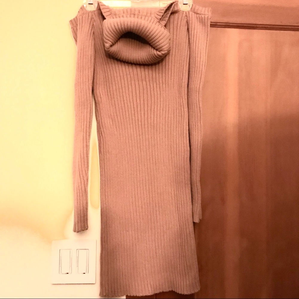 Cozy knit cold shoulder turtleneck sweater.